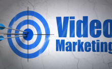 Business concept: target and Video Marketing on wall background
